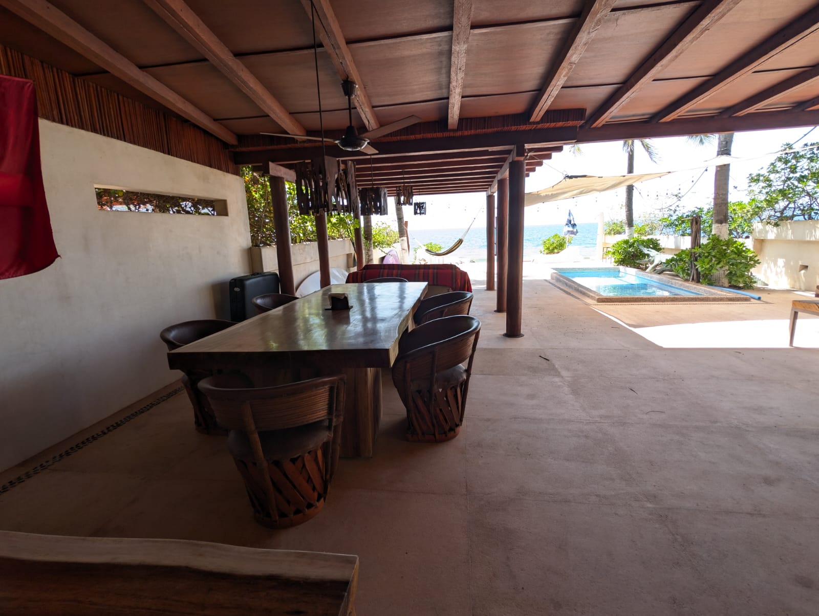 Shared table and pool terrace at Casa de la Luna