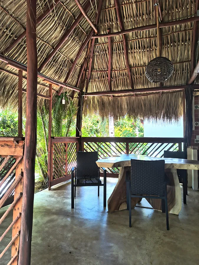 Dining under the palapa, with the sea beyond