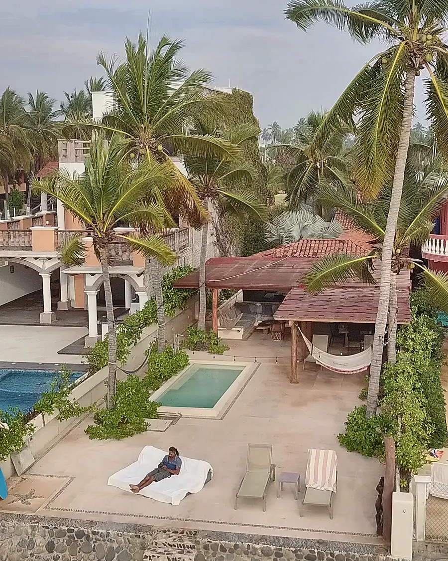 The pool terrace and the hammock palapa, steps from the beach
